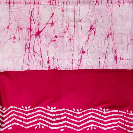 Cotton saree with light pink body and dark pink border. Body has dark pink thread like batik lines and border has white batik zigzag patterns.