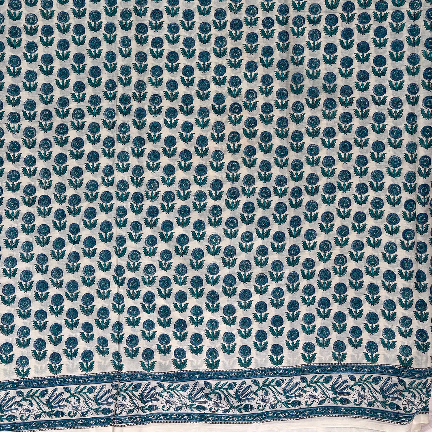 Mint Green cotton saree with dark green floral booti blockprint all over and a green border.