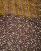 A natural dye dabu block print saree in tussar by modal saree in yellow and brown combination 