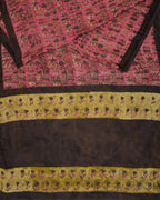 A natural dye dabu handblock print saree in tussar by modal fabric in pink and yellow combination.