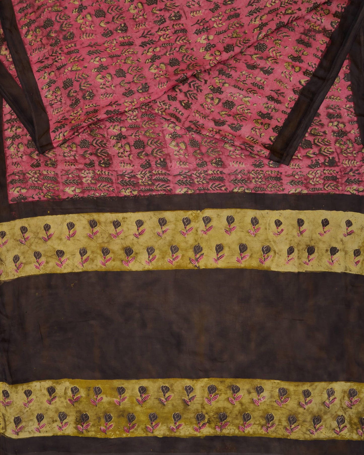 A natural dye dabu handblock print saree in tussar by modal fabric in pink and yellow combination.