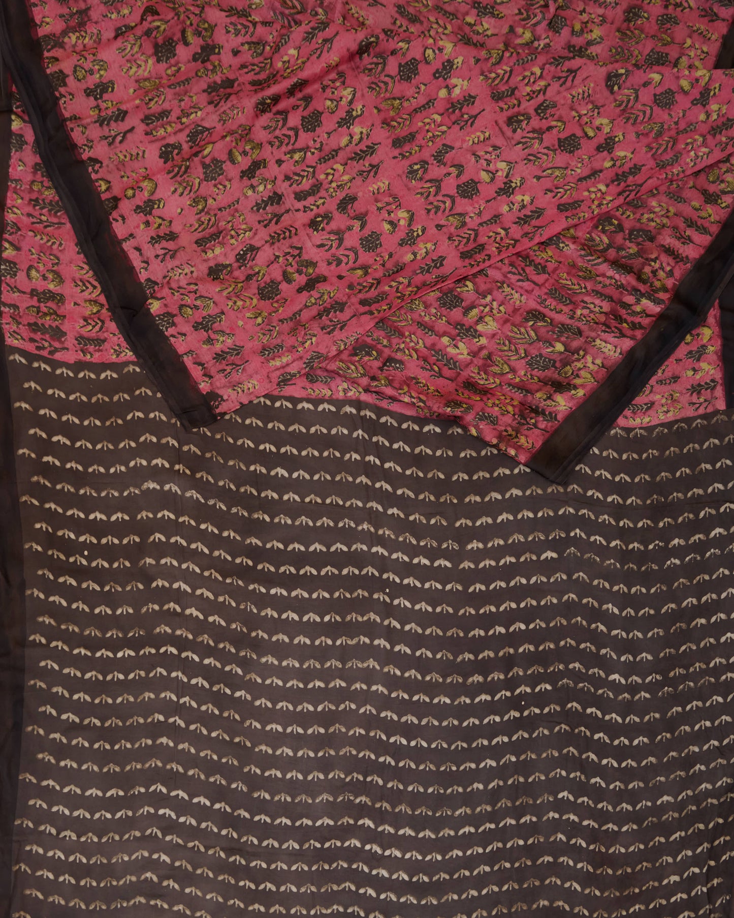 A natural dye dabu handblock print saree in tussar by modal fabric in pink and yellow combination.