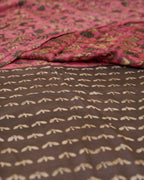 A natural dye dabu handblock print saree in tussar by modal fabric in pink and yellow combination.
