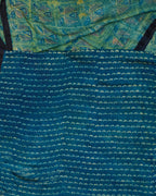 A green and blue combination tussar by modal saree in dabu handblock.