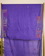 Purple Kosa silk saree with intricate Lambani embroidery on the blouse material on display.