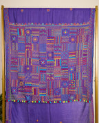 Purple Kosa silk saree with intricate Lambani embroidery on pallu and booti on body of the saree on display.
