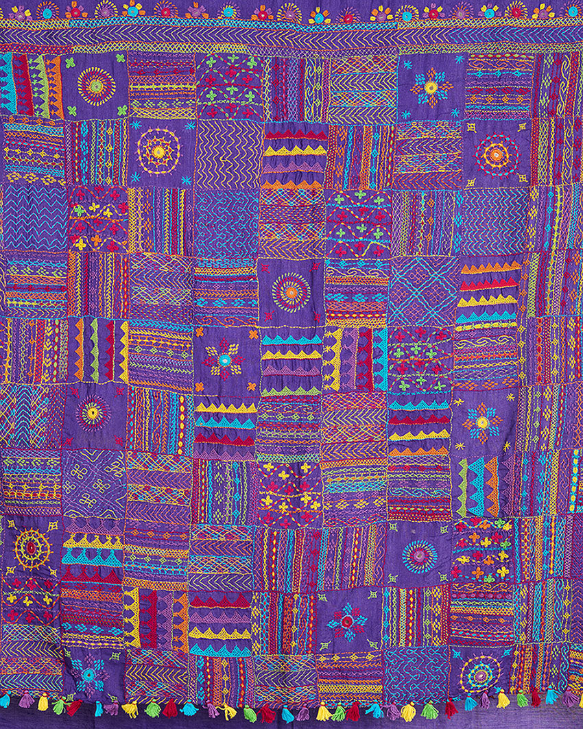 Close up of Lambani embroidery on the pallu of a purple Kosa silk saree 