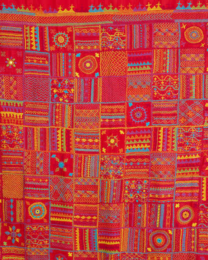Close up of the Lambani embroidery on the pallu of Red Kosa silk saree.