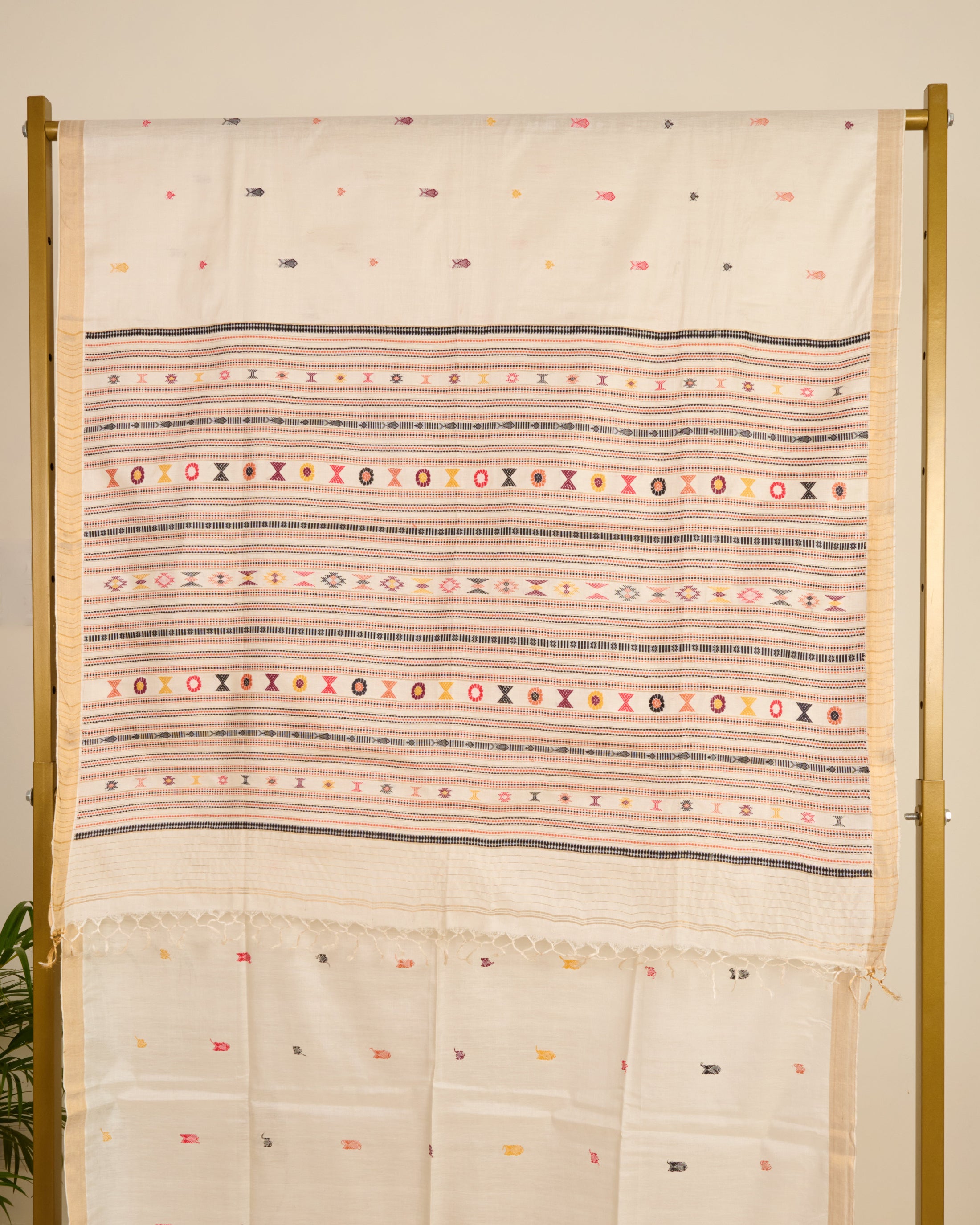 Kosa silk saree in ivory shade with extra weft motifs on display