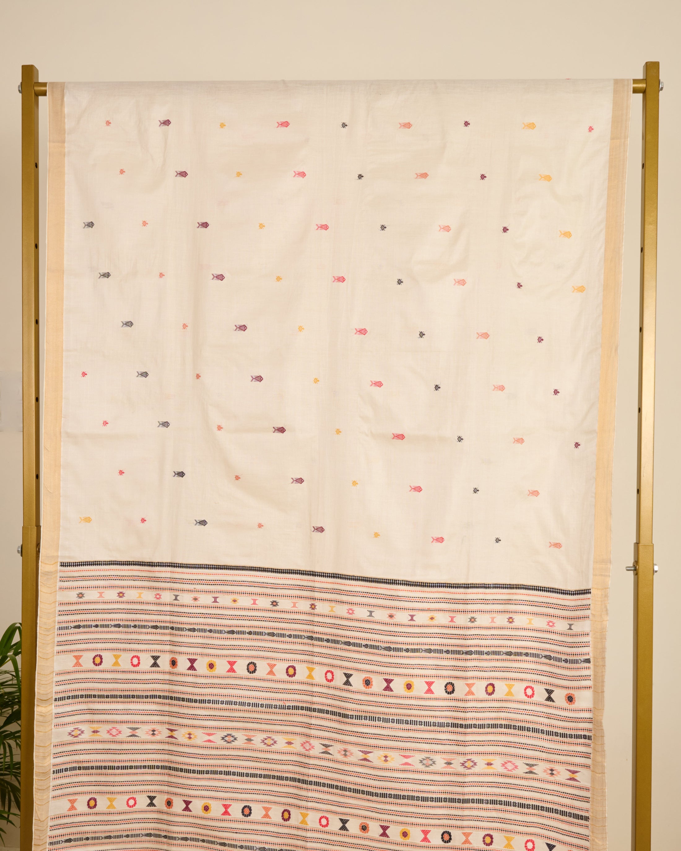 Kosa silk saree in ivory shade with extra weft motifs on display