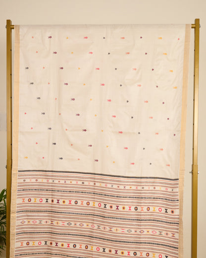 Kosa silk saree in ivory shade with extra weft motifs on display