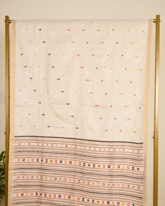 Kosa silk saree in ivory shade with extra weft motifs on display