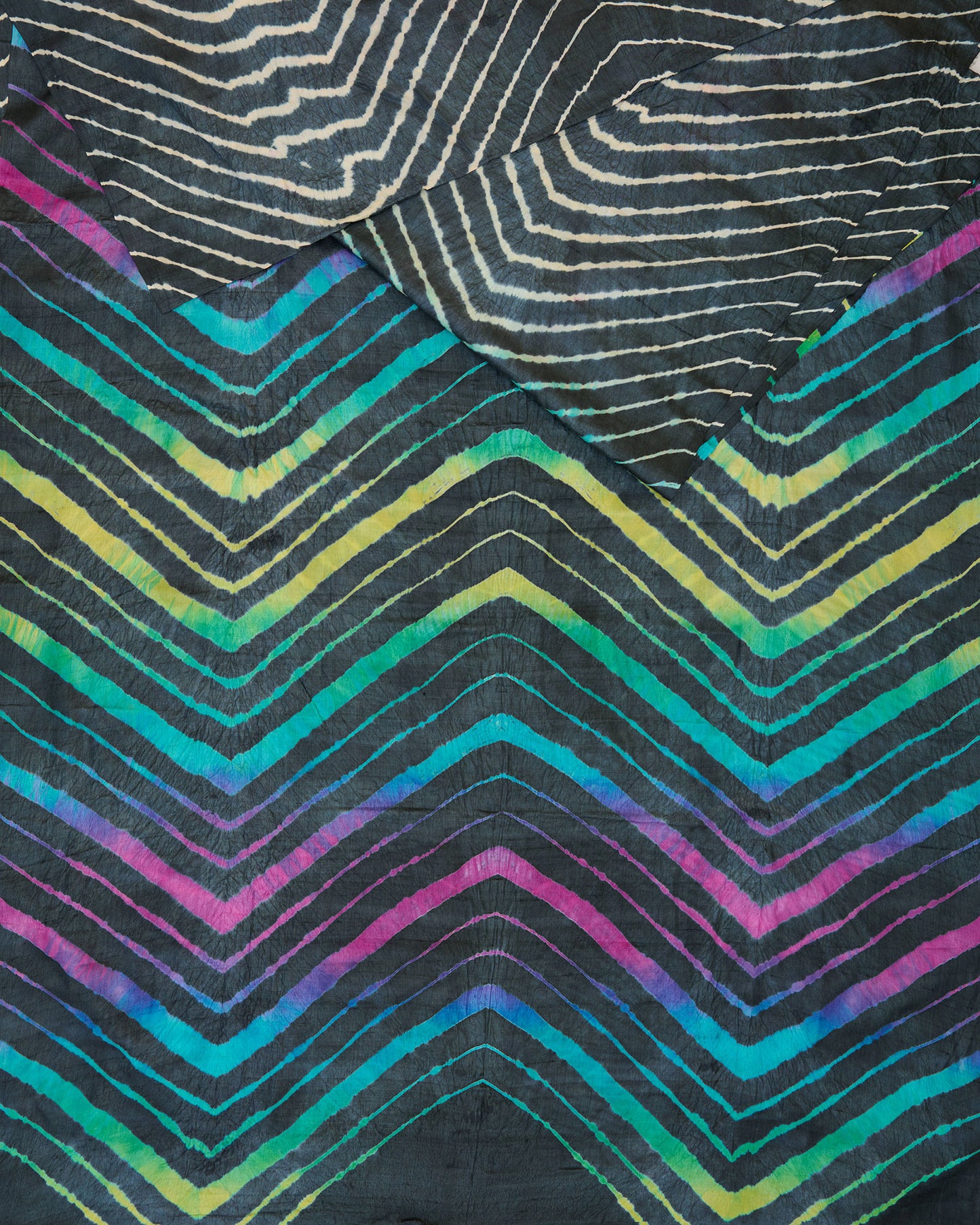 A black leheriya saree with multicolour leheriya on pallu