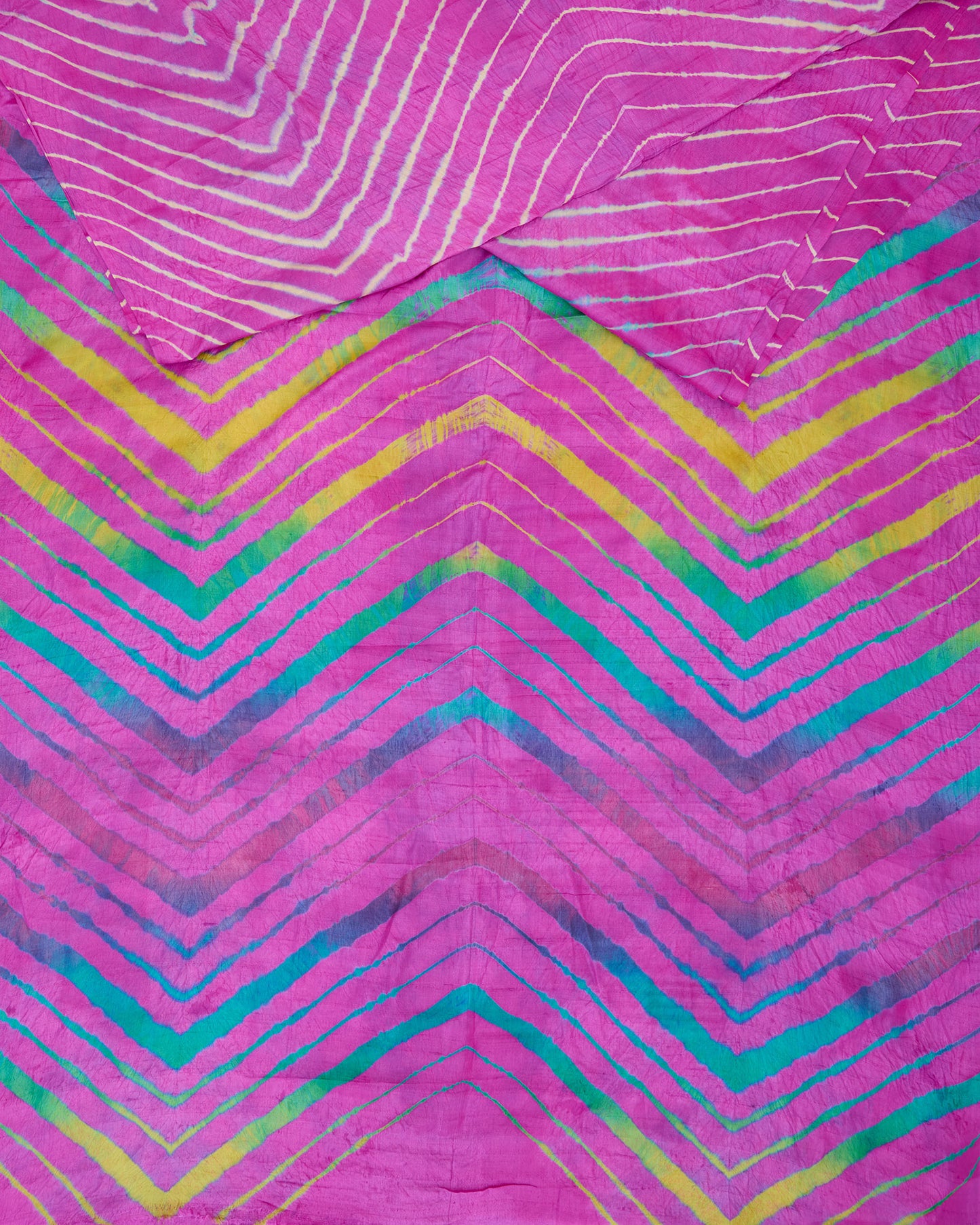 A pink toned all over leheriya saree with multi colour leheriya on pallu