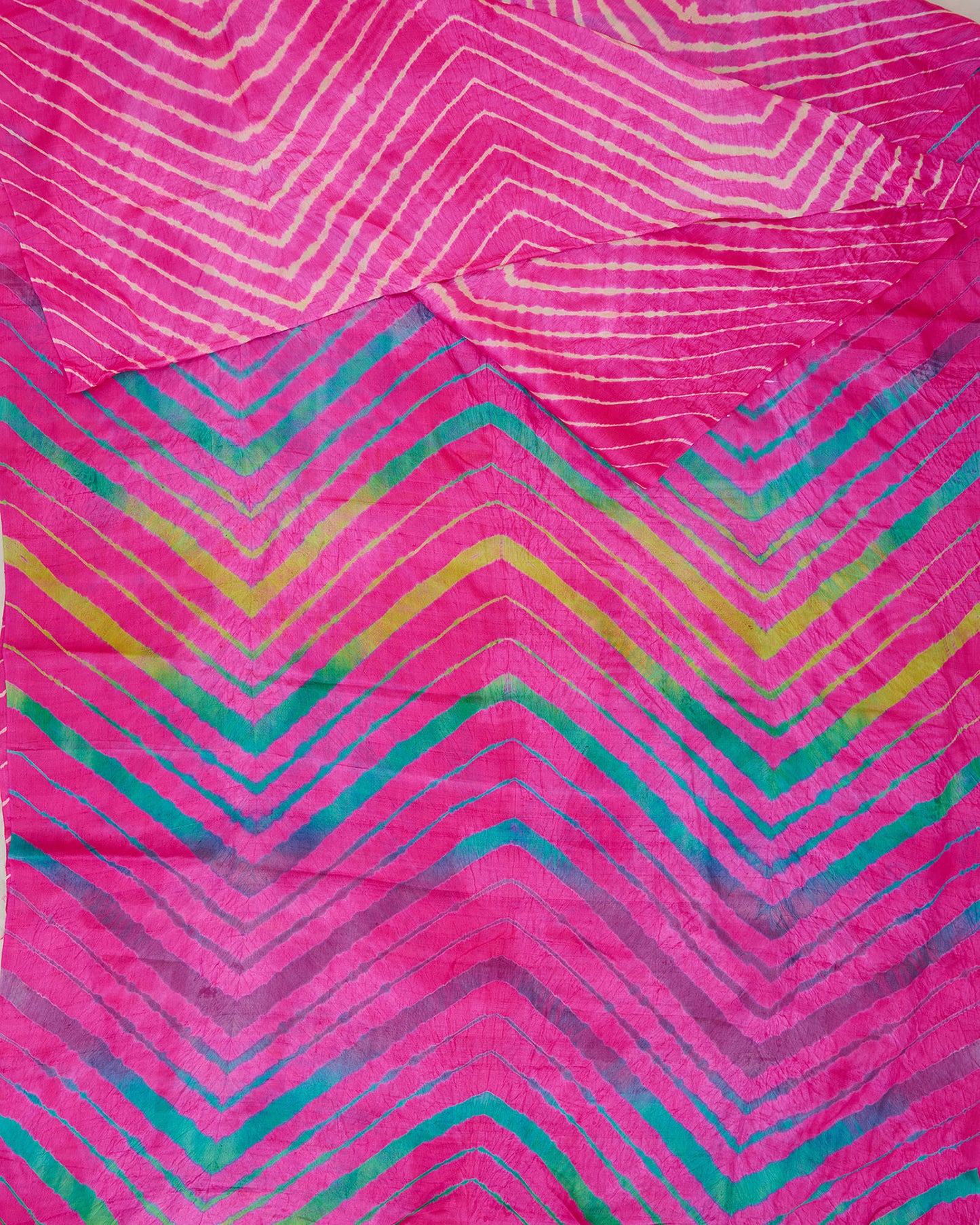 A pink toned all over leheriya saree with multi-colour leheriya on pallu