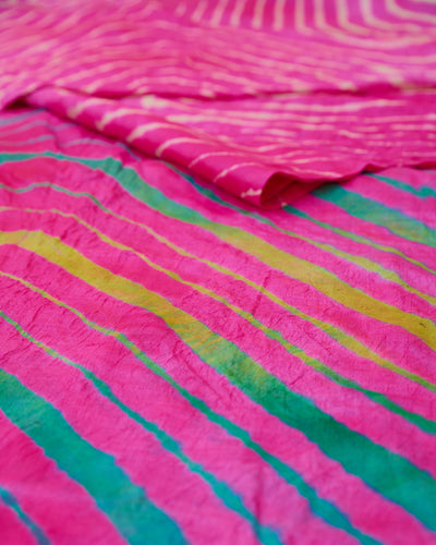Close up of a pink toned multicolour leheriya saree