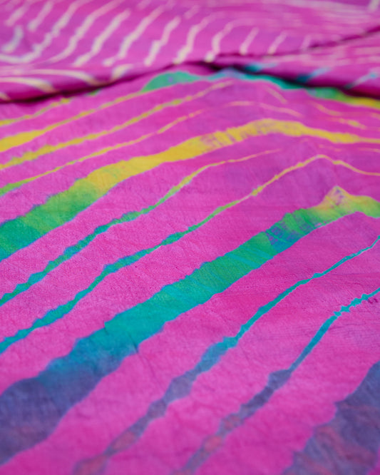 Close up of a pink toned multicolour leheriya saree