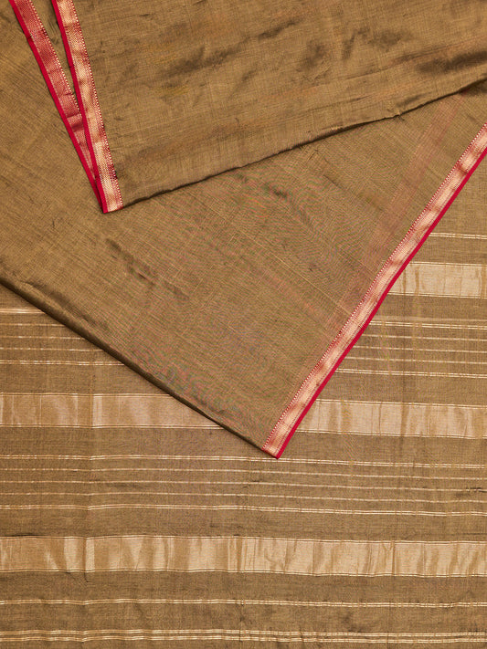 A maheshwari tissue saree in dual tone of black and gold displayed on a flat surface.