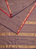 Maheshwari Tissue saree with dual tone of gold and blue laid out