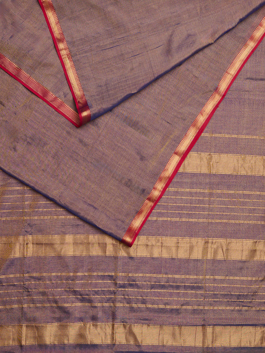 Maheshwari Tissue saree with dual tone of gold and blue laid out
