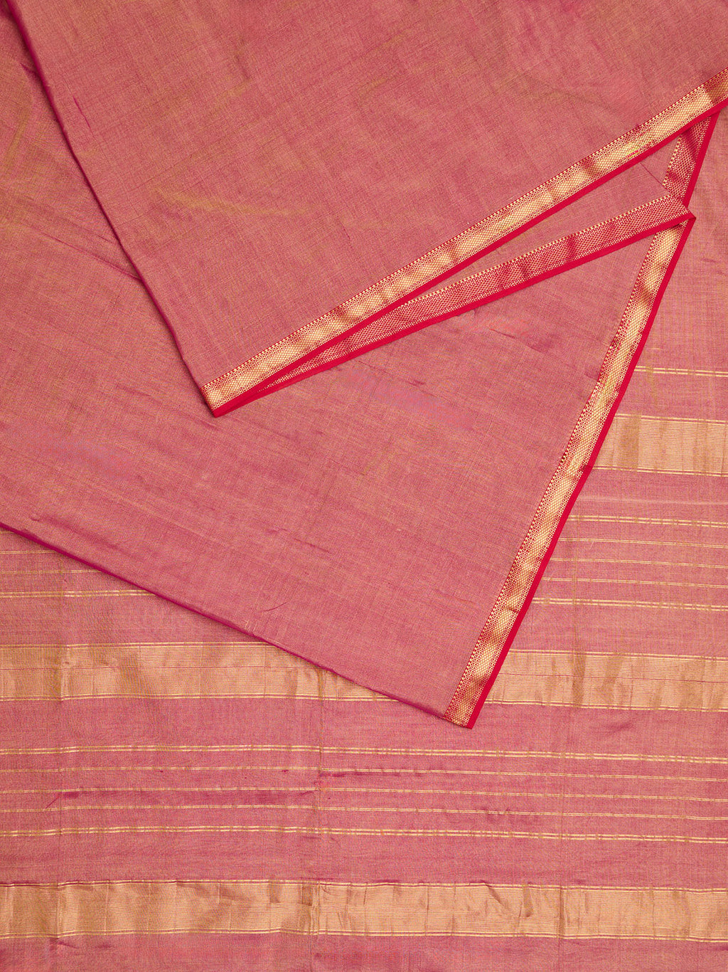 A maheshwari tissue saree in dual tone of red and gold displayed on a flat surface.