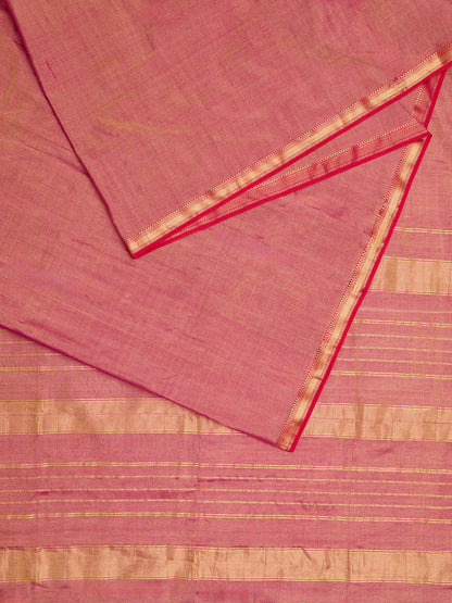 A maheshwari tissue saree in dual tone of red and gold displayed on a flat surface.