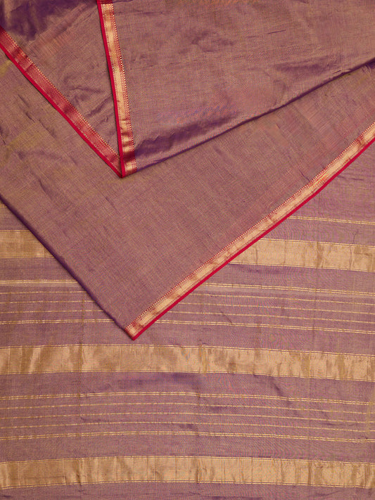 A dual tone Maheshwari Tissue saree in violet and gold displayed 
