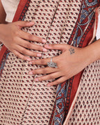 Model wearing a ghungroo ring shaped as a tortoise on her index finger. 