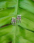 Kolhapuri saaj inspired earrings with red stones studded and pearls.