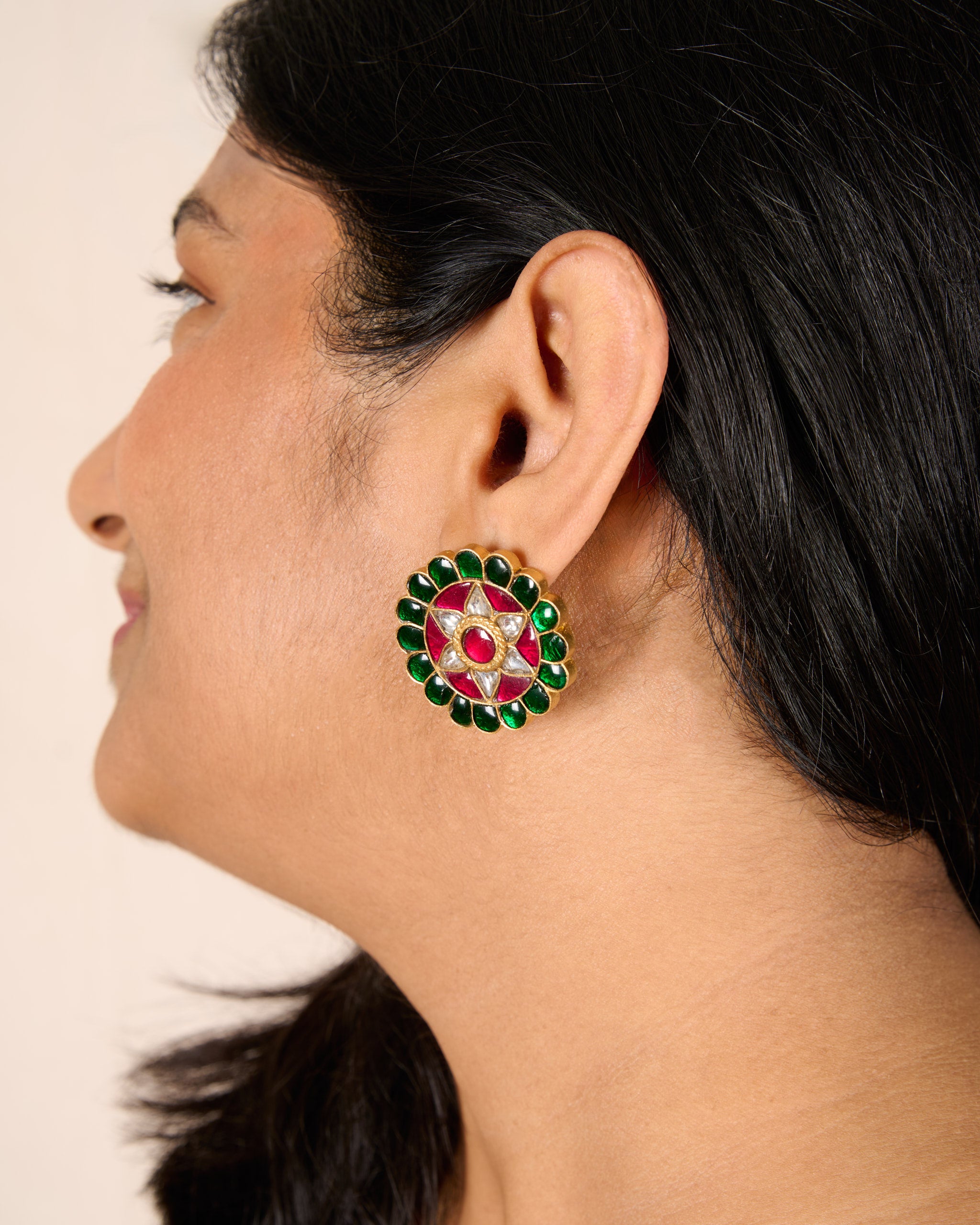 Model wearing gold plated 92.5 silver kundan earrings