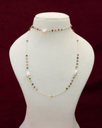 A long chain with beads of tourmaline and baroque pearls in 92.5 silver