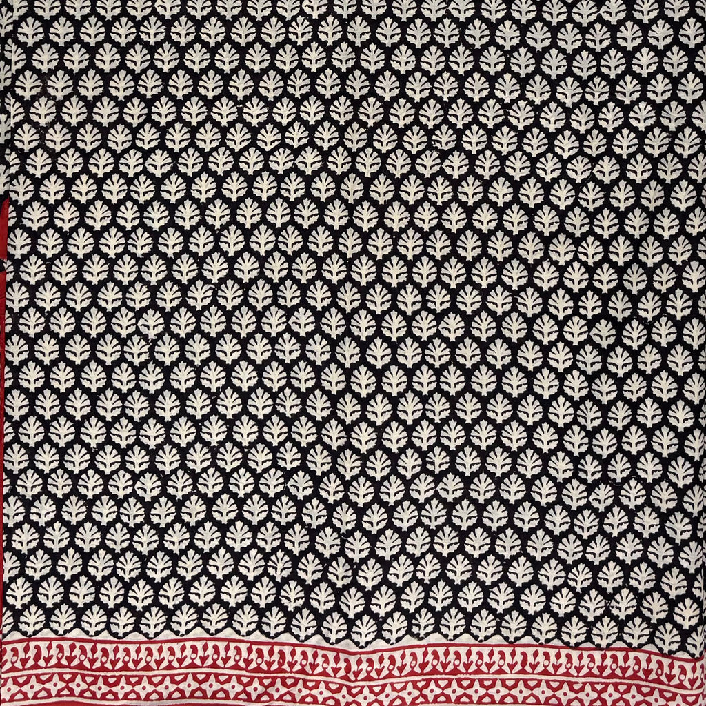 Black base cotton block printed saree with beige booti print all over and red border.