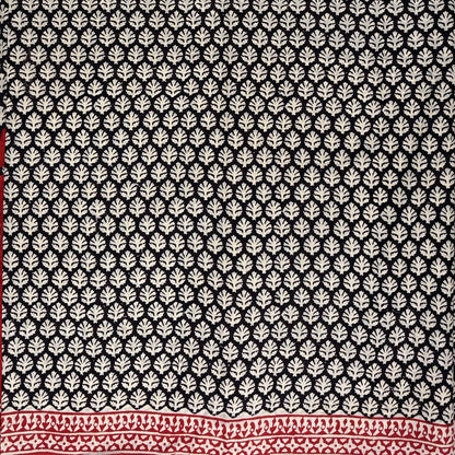Black base cotton block printed saree with beige booti print all over and red border.