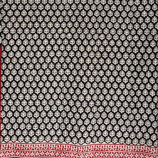 Black base cotton block printed saree with beige booti print all over and red border.