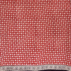 Red base colour cotton block printed saree with small beige flower booti print all over and a black border.