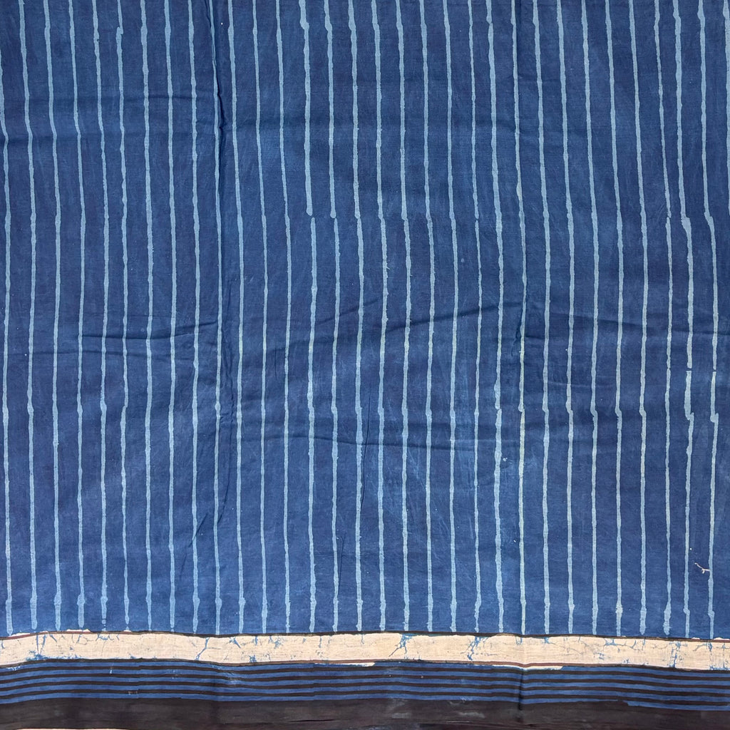 Indigo colour cotton saree with blockprinted stripes.