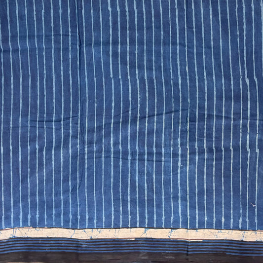 Indigo colour cotton saree with blockprinted stripes.